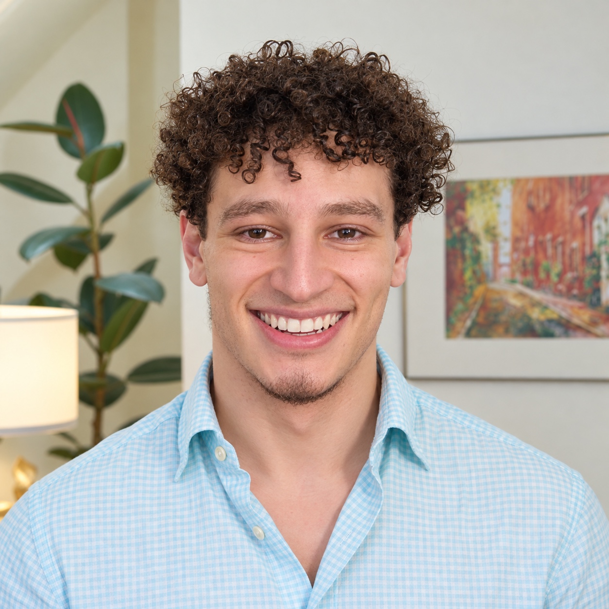 The Voicemaxx founder with a warm, professional smile in his coaching studio